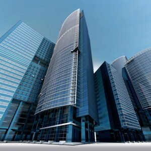 Futuristic urban skyscrapers with glass facades reflecting a vibrant blue sky.
